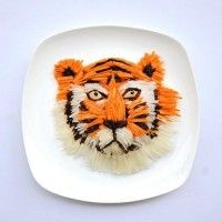 Avec des radis, des carottes et des algues on peut faire un tigre